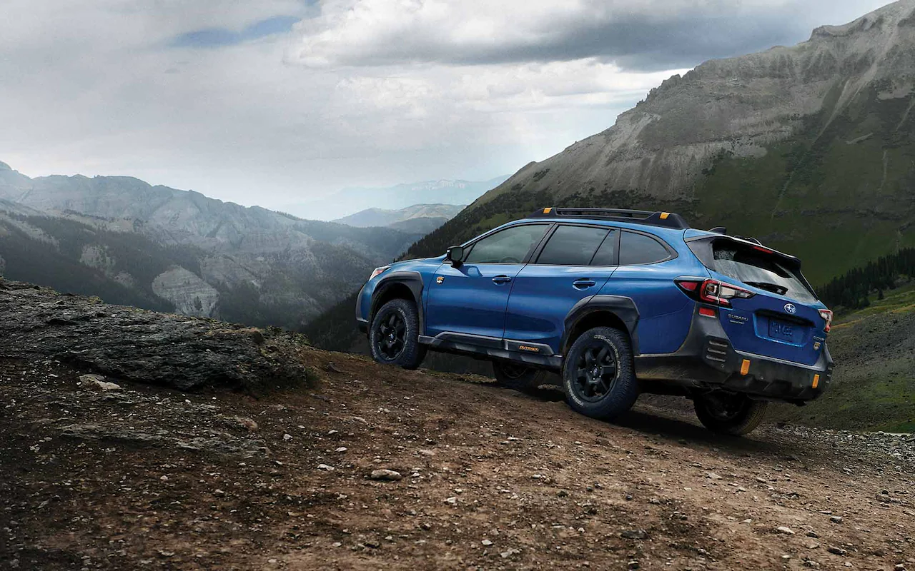 A Subaru Outback Wilderness on a mountain road.